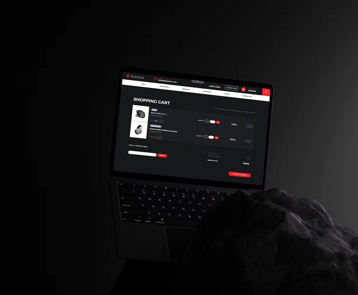 Laptop displaying a dark-themed shopping cart interface for Fyrestore’s gaming eCommerce website, highlighting a modern red-black UI with product details and checkout options.