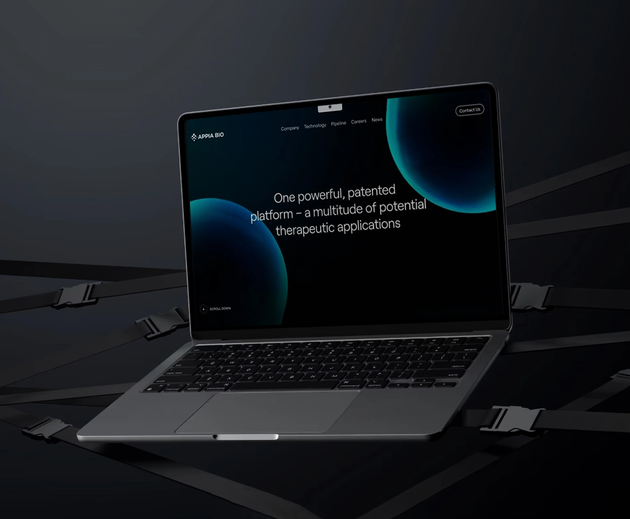Laptop showcasing Appia Bio’s dark-themed biotech website design with futuristic blue planetary graphics and a tagline about patented therapeutic applications.